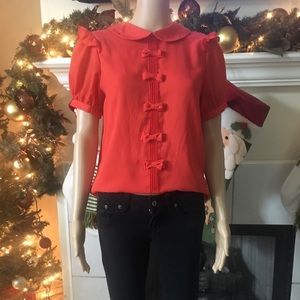 Orange blouse with bows